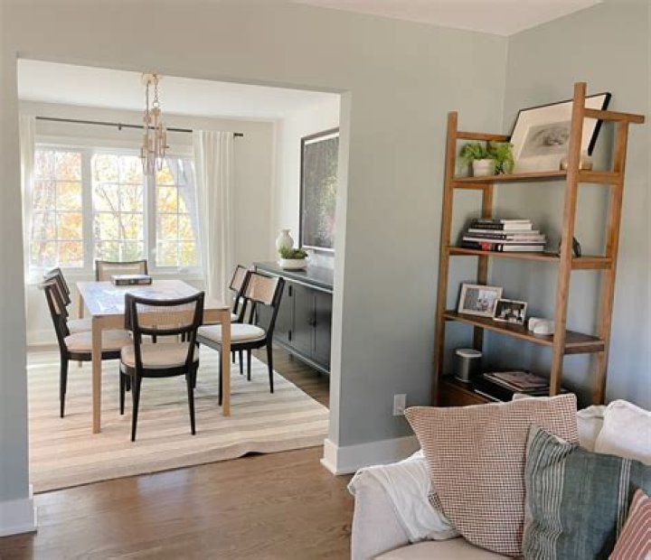 Does Sherwin Williams own Benjamin Moore?