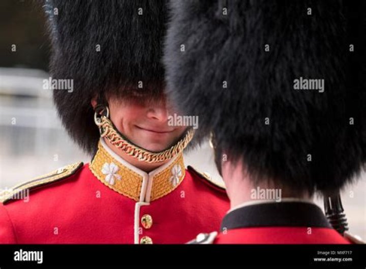 Why do royal guards wear big hats?